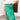 Frontal view of the Flow With Me Midi Skirt that features a green monochromatic houndstooth pattern, an elastic waistband, a side slit, and a midi length.