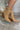 The Slay Western Bootie is a western inspired bootie, featuring a tan suede, western inspired embroidery through out, a pointed toe, a 3" stacked heel, and pull-on tabs for entry.