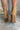 The Slay Western Bootie is a western inspired bootie, featuring a tan suede, western inspired embroidery through out, a pointed toe, a 3" stacked heel, and pull-on tabs for entry.