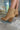 The Slay Western Bootie is a western inspired bootie, featuring a tan suede, western inspired embroidery through out, a pointed toe, a 3" stacked heel, and pull-on tabs for entry.