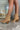The Slay Western Bootie is a western inspired bootie, featuring a tan suede, western inspired embroidery through out, a pointed toe, a 3" stacked heel, and pull-on tabs for entry.