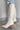 Side view of the Going Places Boot that features a white colored western style boot, featuring a white leather upper, western inspired embroidery, an almond toe, a 2" stacked heel, pull-on tabs for easy entry, and a side zipper.