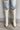 Frontal view of the Going Places Boot that features a white colored western style boot, featuring a white leather upper, western inspired embroidery, an almond toe, a 2" stacked heel, pull-on tabs for easy entry, and a side zipper.