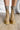 The Melanie Knit Boot is a mid-calf boot featuring a knit upper, a rubber lug sole, a 1" platform, and a 3" heel. 