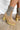 The Melanie Knit Boot is a mid-calf boot featuring a knit upper, a rubber lug sole, a 1" platform, and a 3" heel. 