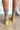 The Melanie Knit Boot is a mid-calf boot featuring a knit upper, a rubber lug sole, a 1" platform, and a 3" heel. 