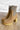 The Melanie Knit Boot is a mid-calf boot featuring a knit upper, a rubber lug sole, a 1" platform, and a 3" heel. 