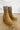 The Melanie Knit Boot is a mid-calf boot featuring a knit upper, a rubber lug sole, a 1" platform, and a 3" heel. 