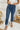 Frontal view of the Flying Monkey: Ease Mom Jeans that features a dark wash denim, a front button and zip closure, two front pockets, a cuffed bottom hem, two back pockets, and a mom jean fit.