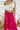 Frontal view of the My Muse Crop Top that features an ivory PU material, a sleeveless design with a straight neckline, a bow detail at the bust, a smocked back, and a cropped fit.