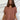 Frontal view of the Golden Days Top that features a brick material, a collared neckline, a short cuffed sleeve, a button-up front, a front pocket, and a flowy fit.