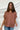 Frontal view of the Golden Days Top that features a brick material, a collared neckline, a short cuffed sleeve, a button-up front, a front pocket, and a flowy fit.