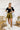 Frontal view of the Make It Mine Skort that features a moss green silk material, a high-rise fit, an elastic waist band, a flowy ruffle bottom, a shorts lining, and a back zipper closure.