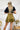 Back view of the Make It Mine Skort that features a moss green silk material, a high-rise fit, an elastic waist band, a flowy ruffle bottom, a shorts lining, and a back zipper closure.