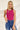 Frontal view of the West Side Bodysuit that features a magenta cotton material, a round neckline, a sleeveless design with thick straps, a bikini bottom, and a snap closure.