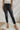 Frontal view of the Flying Monkey: Amie Straight Leg Jeans that features a faded black wash denim, a high-rise fit, a four button closure, two front pockets, a distressed ankle hem, two back pockets, and a straight leg fit.