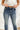 Frontal view of the Rooted Denim: Elodie Bootcut Jeans that features a dark wash denim, a front button and zipper closure, two front pockets, two back pockets, and a bootcut fit.