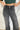 Frontal view of the Rooted Denim: Crue Flare Jeans that features a faded black wash denim, a front two button and zip closure, two front pockets, a frayed bottom hem, two back pockets, and a flare fit.