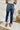 Back view of the Kancan: Maisie Straight Leg Jeans that features a dark wash denim with distress details, a high-rise fit, a front two button and zip closure, two front pockets, a faded ankle hem, two back pockets, and a straight leg fit.