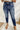 Frontal view of the Kancan: Maisie Straight Leg Jeans that features a dark wash denim with distress details, a high-rise fit, a front two button and zip closure, two front pockets, a faded ankle hem, two back pockets, and a straight leg fit.