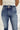 Frontal view of the Kancan: Maisie Straight Leg Jeans that features a dark wash denim with distress details, a high-rise fit, a front two button and zip closure, two front pockets, a faded ankle hem, two back pockets, and a straight leg fit.