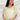 Frontal view of the Soul Searching Top that features an ivory material, a multi-colored floral print, a scoop neckline, a short flowy sleeve with a ruffle hem, and a flowy fit.