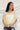 Frontal view of the Soul Searching Top that features an ivory material, a multi-colored floral print, a scoop neckline, a short flowy sleeve with a ruffle hem, and a flowy fit.