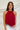 Frontal view of the Unwritten Tank Top that features a red material, a halter neck, a sleeveless design, a pointed front and back, and a flowy fit.