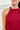 Frontal view of the Unwritten Tank Top that features a red material, a halter neck, a sleeveless design, a pointed front and back, and a flowy fit.