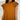 Frontal view of the Hampton Social Top that features a caramel material, a high rounded neckline with a ruffle hem, a short flowy sleeve, a pleated design, a lettuce edge bottom hem, and a flowy fit.