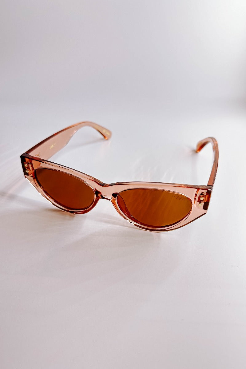 Front view of the I-Sea: Carly Sunglasses in Watermelon & Brown which features cat-eye shaped light pink frames with brown lenses.