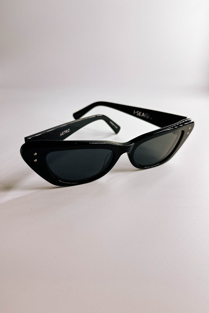 Front view of the I-Sea: Astrid Sunglasses in Black which features cat-eye shaped black frames with black lenses.