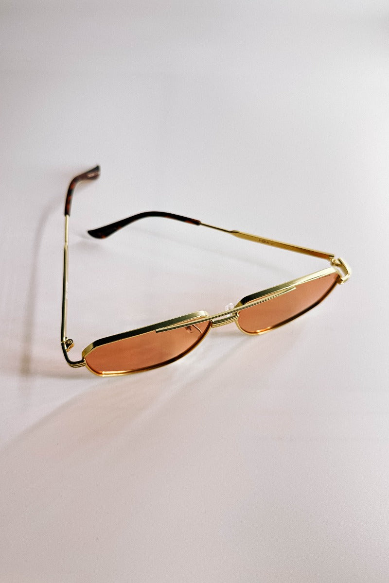 Front view of the I-Sea: Bliss Sunglasses in Gold & Amber features aviator shaped gold frames with amber lenses.