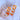 The Sweet Escape Earring is an acrylic dangle style earring featuring a three chain link design with one link a matte orange and the other two a clear orange ombre.