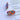 The Live Colorfully Earring is a stud style earring featuring an oval shape with a clear design finished with multi-colored sequins within.