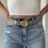 Front view of model wearing the Western Dreams Chain Belt which features thick gold chain with gold braided details and a gold buckle for closure.