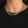 Close up view of model wearing the Brooklyn Gold Chain Necklace which features one gold layer of open circle chain links.