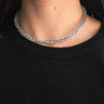 Close up view of model wearing the Maya Rhinestone Adjustable Necklace which features clear rectangle and circle stones with gold adjustable clasp closure.