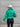 Back view of model wearing the Call It Even Puffer Jacket features green puffer fabric, two front pockets, a high neckline, a silver zip up, and long sleeves