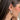 Side view of model wearing the String Multi Lights White Open Hoop which features mini white open hoops with gold and multi color string light details.
