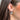 Side view of model wearing the Holly Silver Glitter Hoop which features mini open silver glitter hoops with holly flower designs.