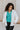 Front close up view of model wearing the Get Cozy Jacket which features plush ivory fabric with a checkered pattern, a zip up front, long sleeves and a collared neckline.