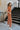 Right side view of the Talk To Me Jumpsuit which features rust corduroy fabric, a front zipper with a silver button closure, 2 chest pockets, 2 side pockets, a collared neckline and short sleeves.