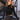 Front view of model wearing the Liana Mock Neck Top In Black, that features black ribbed fabric, cropped waist, high neckline and long sleeves