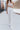 Front view of model wearing the At Your Leisure Pants, which feature ribbed knit beige fabric and an elastic waist.