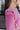 Close-up side shoulder view of model wearing the Lucky Me Sweater in Pink.