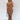 Full body front view of model wearing the Liliana Brown Asymmetrical Sleeveless Midi Dress that has light brown knit fabric, an asymetrical ruffle hem, midi length, square neckline, adjustable straps and sleeveless.
