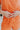 The Something Orange Ring Set is a set of three rings; a gold band with pink and orange hearts, a gold band with pink flowers, and a thick gold band with one large orange flower.