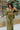 Frontal view of the All Your Life Pants that features a green satin material, a high-rise fit, a thick elastic waist band with an adjustable tie, and a wide leg fit.