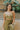Frontal view of the All Your Life Brami that features a green satin material, a V neckline, a sleeveless design with thin adjustable straps, and a smocked back.